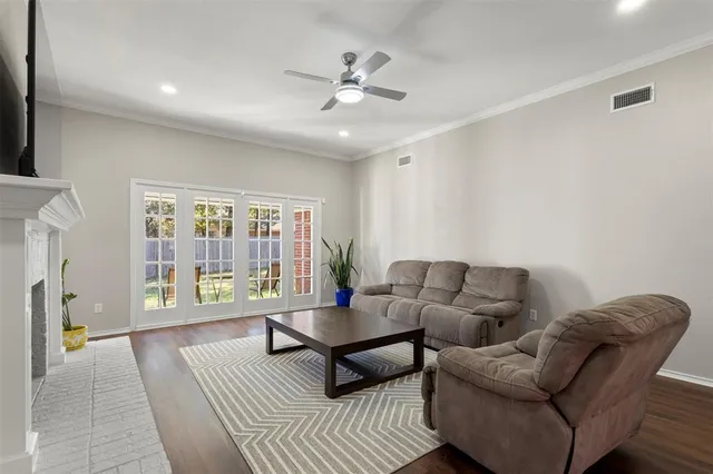 a living room with furniture and a large window with outer view