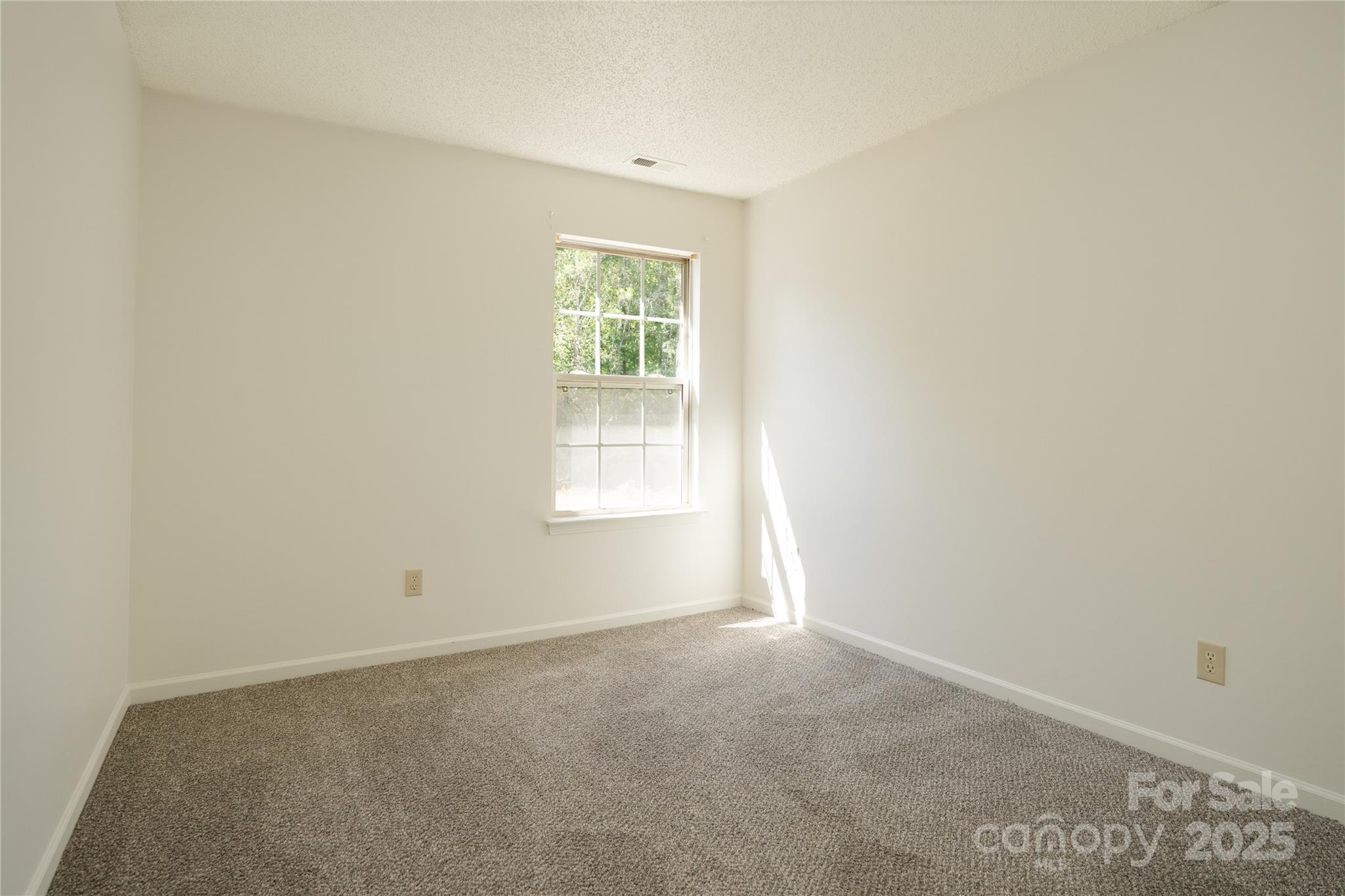 2893 Signal Court Southwest Concord, NC 28025 - Photo 26 of 32 an empty room with a window