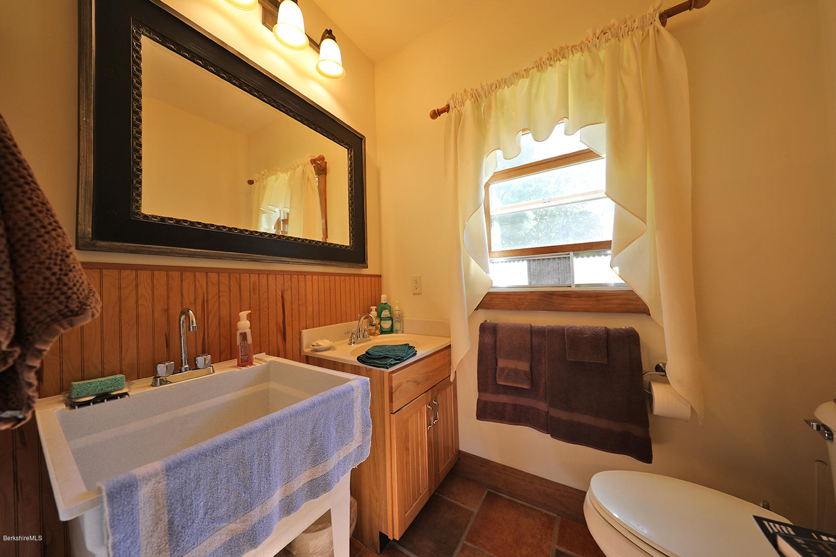 11 Stump Road Sandisfield, MA 01255 - Photo 11 of 41 a bathroom with a sink a toilet and mirror