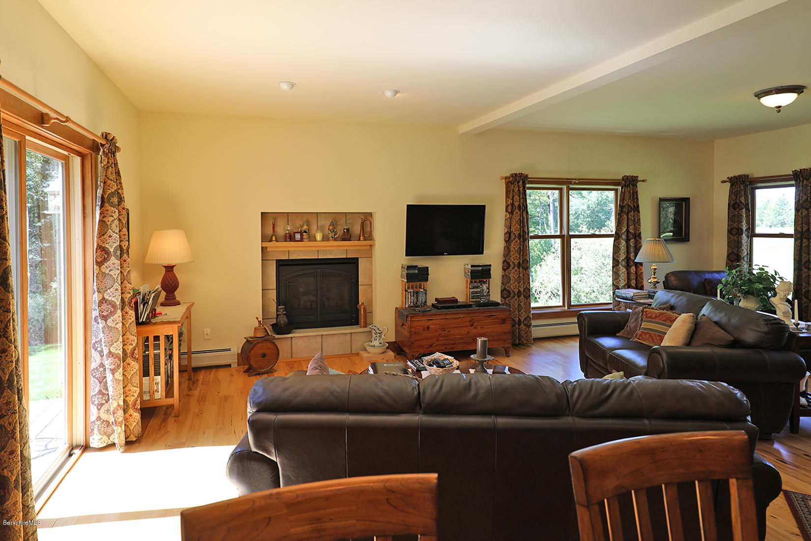 11 Stump Road Sandisfield, MA 01255 - Photo 14 of 41 a living room with furniture and a flat screen tv