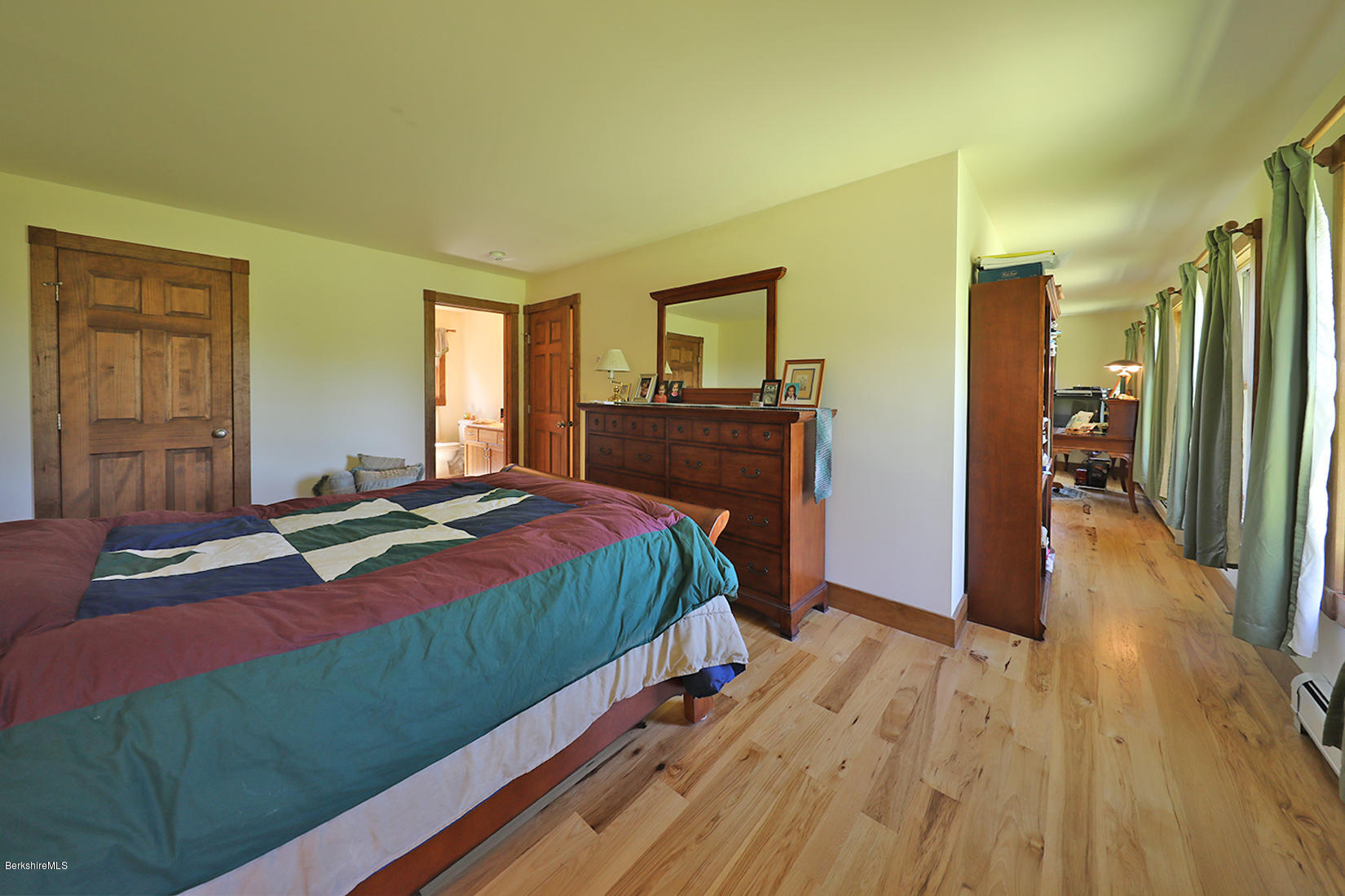11 Stump Road Sandisfield, MA 01255 - Photo 19 of 41 a bedroom with a bed and wooden floor