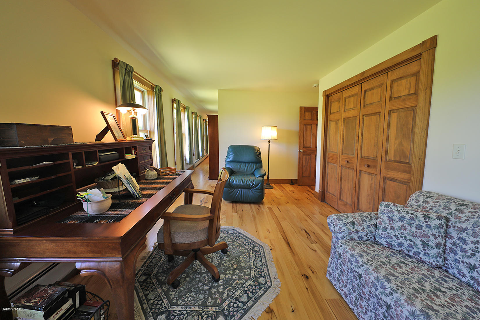 11 Stump Road Sandisfield, MA 01255 - Photo 22 of 41 a bedroom with a bed and wooden floor