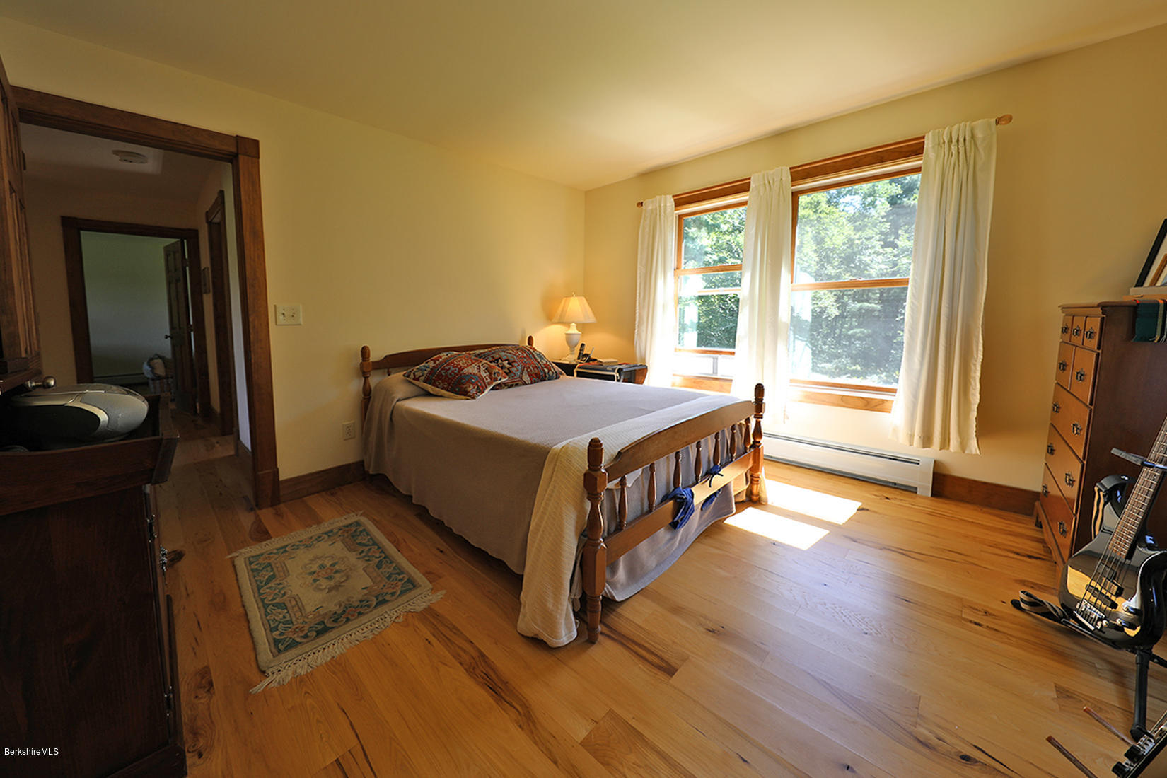 11 Stump Road Sandisfield, MA 01255 - Photo 24 of 41 a bedroom with a bed and a flat tv screen on a dresser