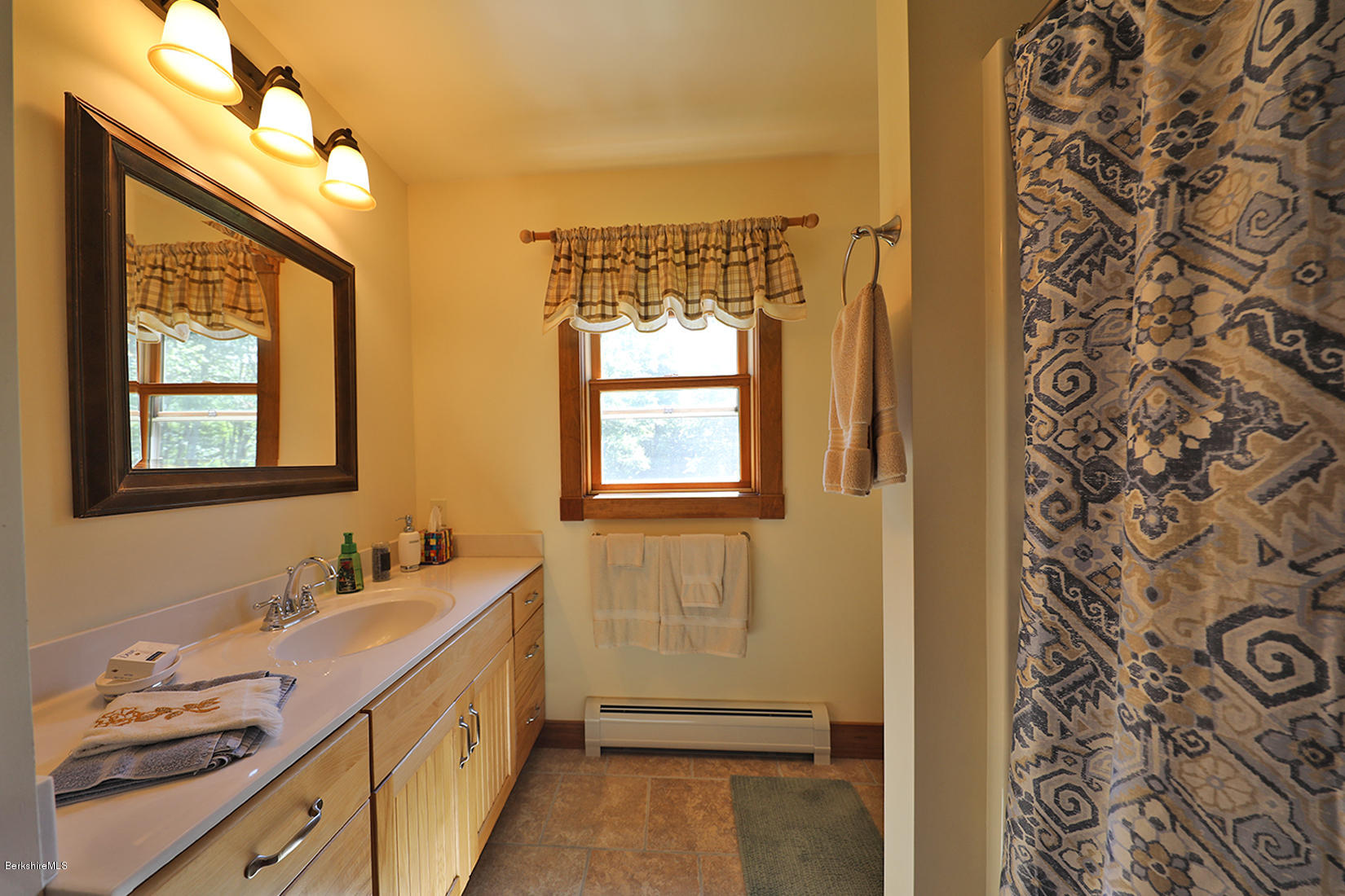 11 Stump Road Sandisfield, MA 01255 - Photo 26 of 41 a bathroom with a double vanity sink and a mirror