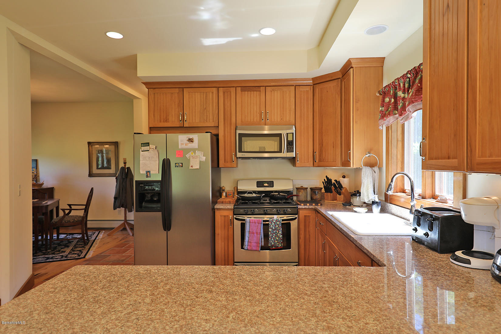 11 Stump Road Sandisfield, MA 01255 - Photo 4 of 41 a kitchen with stainless steel appliances granite countertop a refrigerator a stove top oven a sink and dishwasher
