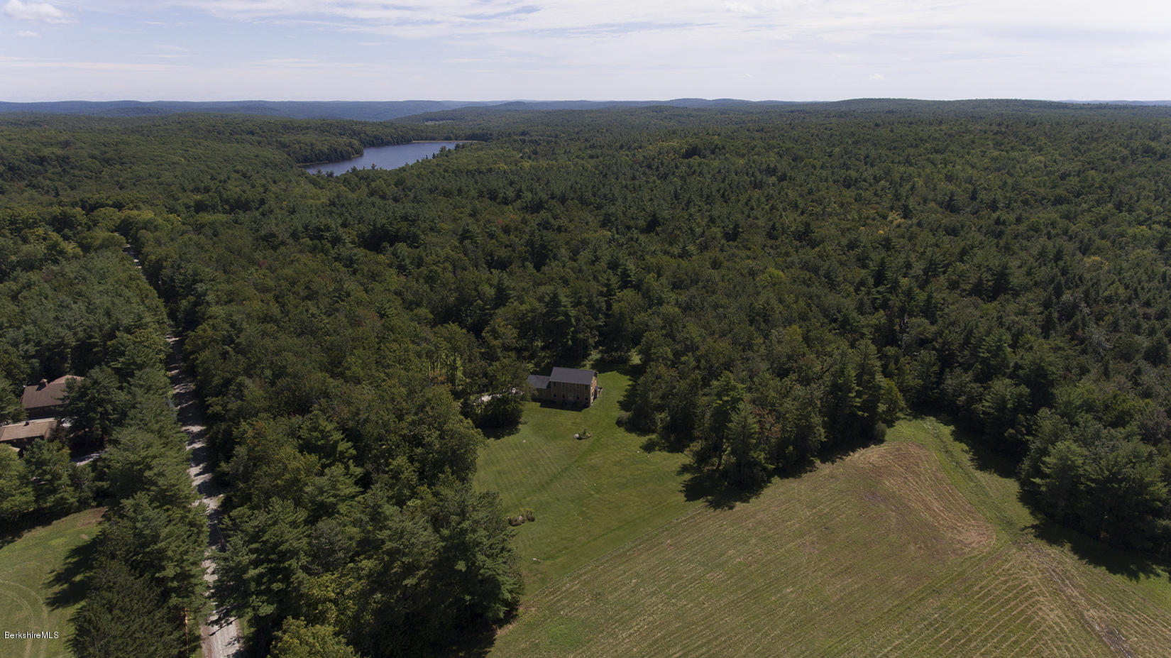 11 Stump Road Sandisfield, MA 01255 - Photo 35 of 41 a view of a town with mountains in the background