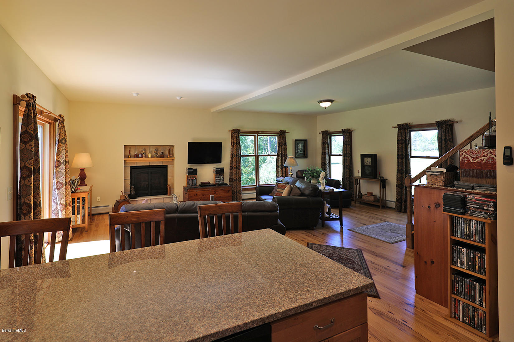 11 Stump Road Sandisfield, MA 01255 - Photo 5 of 41 a living room with furniture a flat screen tv and a refrigerator