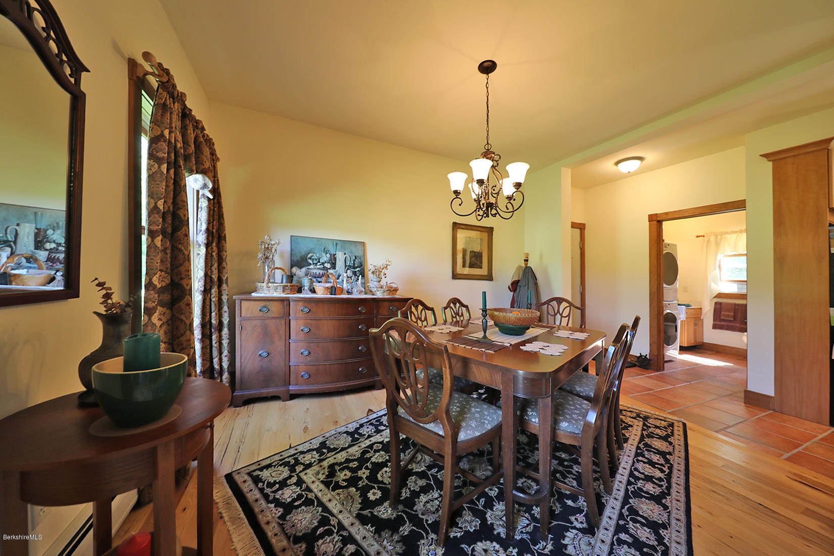11 Stump Road Sandisfield, MA 01255 - Photo 8 of 41 a view of a dining room with furniture a chandelier and wooden floor