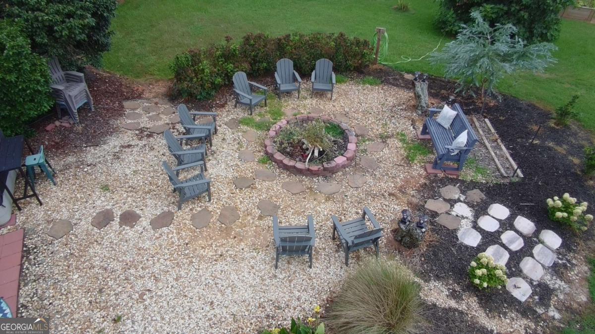 876 Simpson Mill Road Locust Grove, GA 30248 - Photo 23 of 51 a backyard of a house with lots of green space