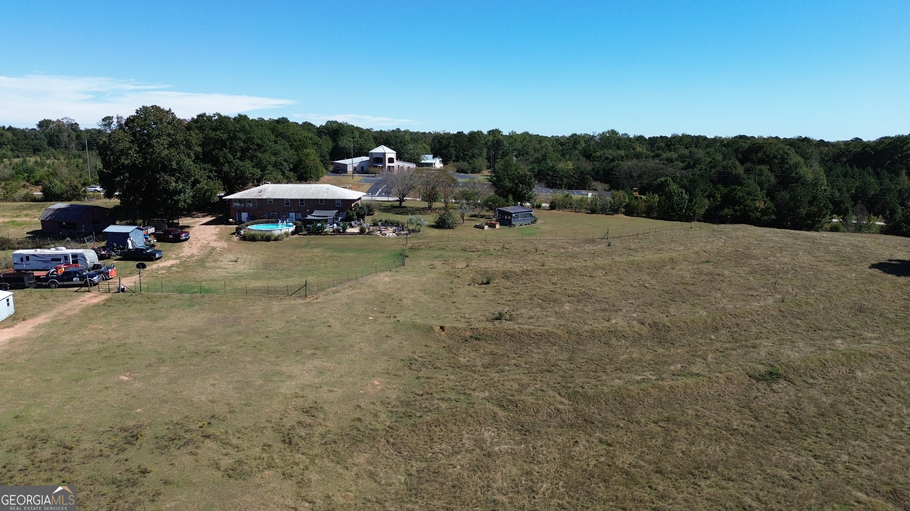 876 Simpson Mill Road Locust Grove, GA 30248 - Photo 27 of 51 a view of a town with barn in the background