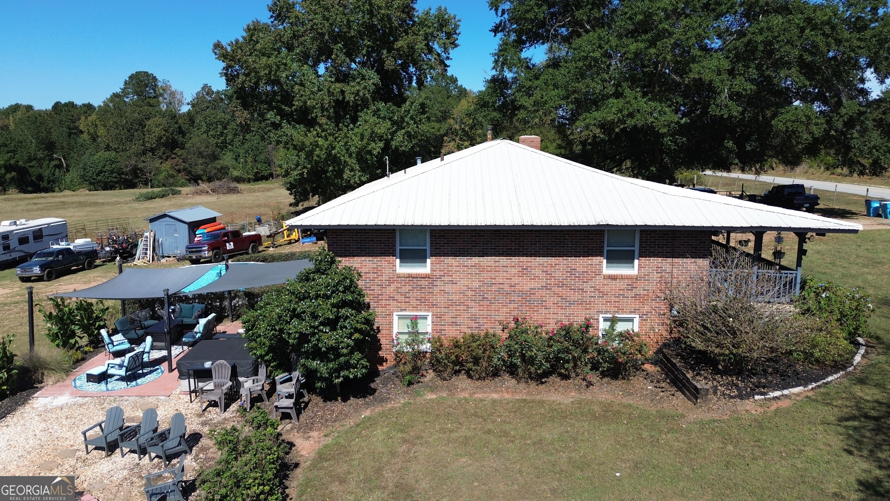 876 Simpson Mill Road Locust Grove, GA 30248 - Photo 33 of 51 an outdoor space with lots of trees and barbeque oven