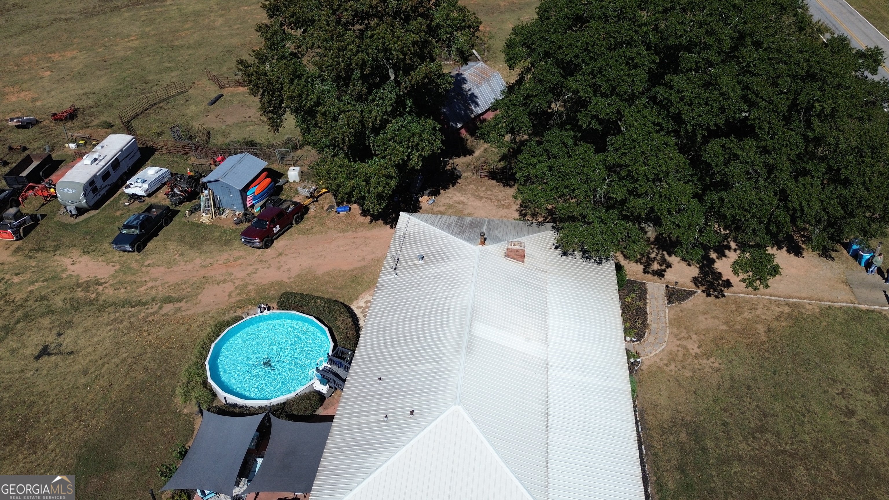 876 Simpson Mill Road Locust Grove, GA 30248 - Photo 39 of 51 an aerial view of a house with swimming pool and outdoor space