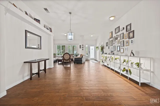 a view of an dining room with furniture window and wooden floor