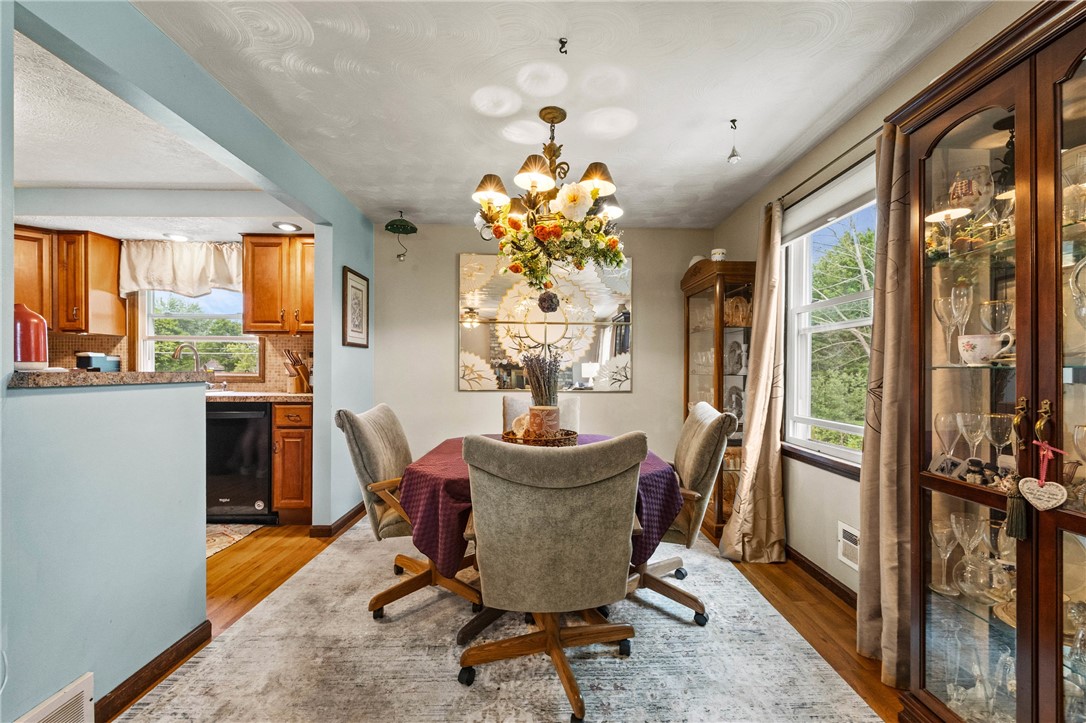 1140 Willits Road Ontario, NY 14519 - Photo 12 of 50 Dining area conveniently located between kitchen and living room. Perfect for entertaining!