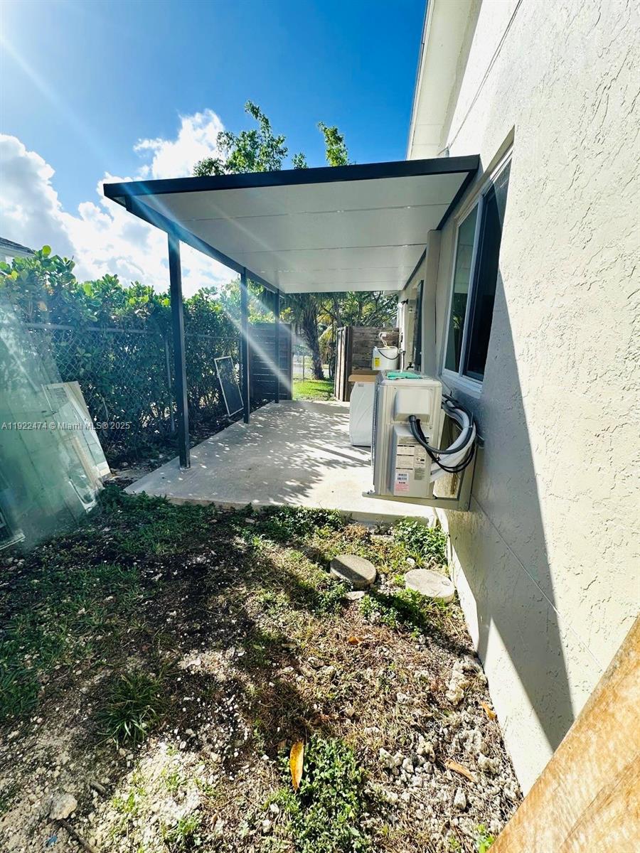 26205 Southwest 133rd Court, Unit 2 Homestead, FL 33032 - Photo 13 of 17 a view of a couches in patio