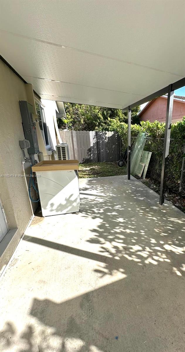 26205 Southwest 133rd Court, Unit 2 Homestead, FL 33032 - Photo 16 of 17 a view of water heater room