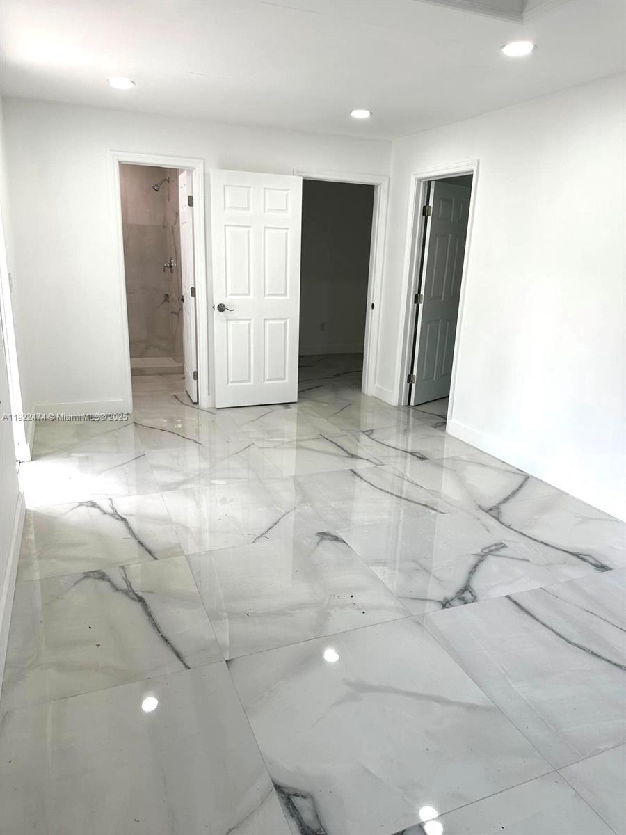 26205 Southwest 133rd Court, Unit 2 Homestead, FL 33032 - Photo 3 of 17 a view of a hallway with closet