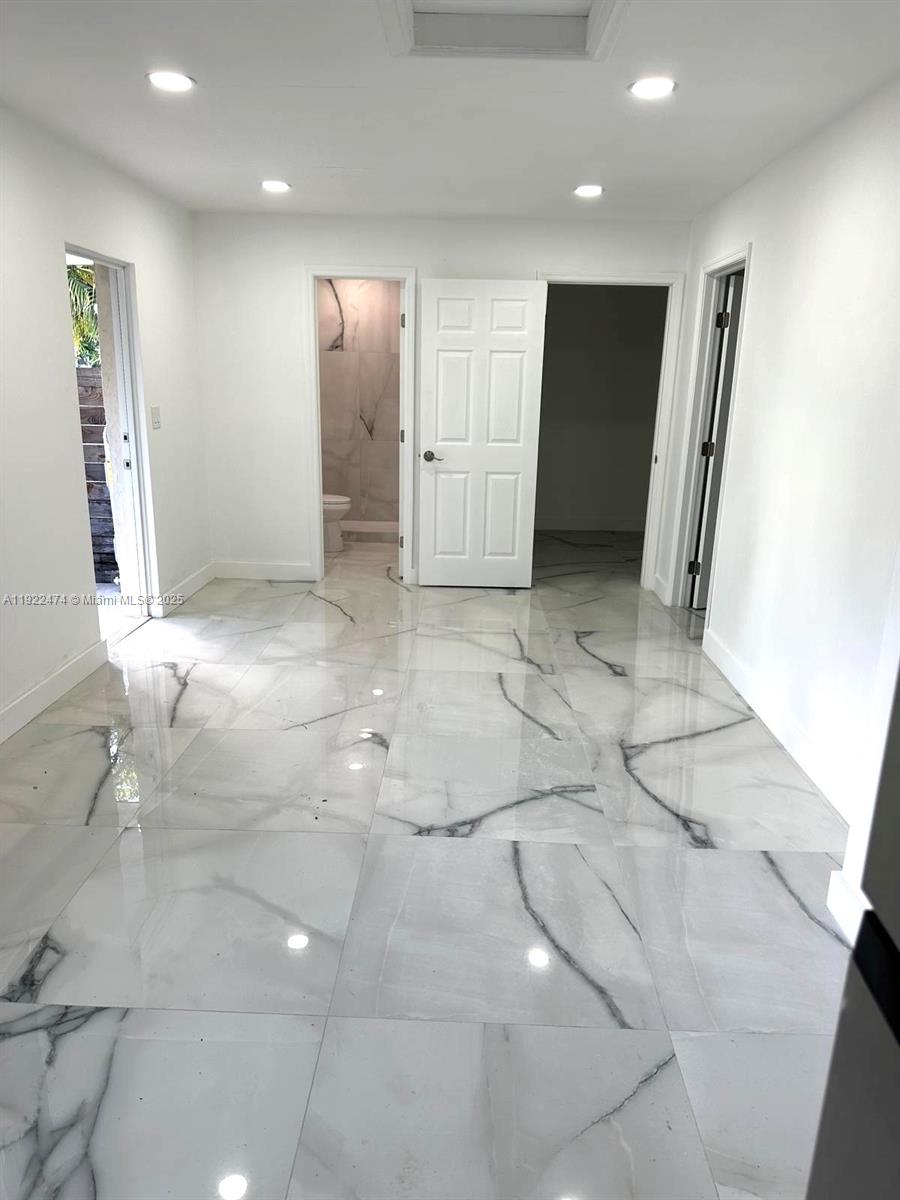 26205 Southwest 133rd Court, Unit 2 Homestead, FL 33032 - Photo 4 of 17 a view of a hallway with closet