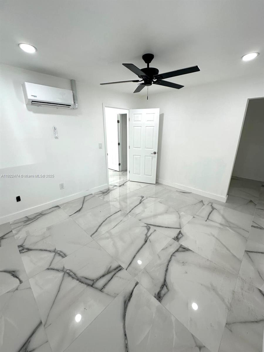 26205 Southwest 133rd Court, Unit 2 Homestead, FL 33032 - Photo 8 of 17 a view of a big room with a ceiling fan