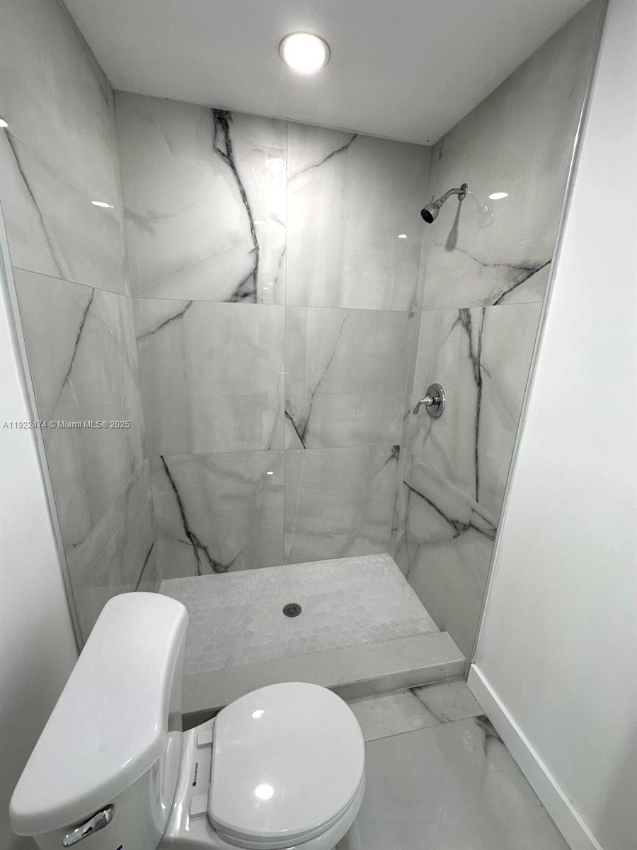 26205 Southwest 133rd Court, Unit 2 Homestead, FL 33032 - Photo 10 of 17 a bathroom with a sink toilet and shower