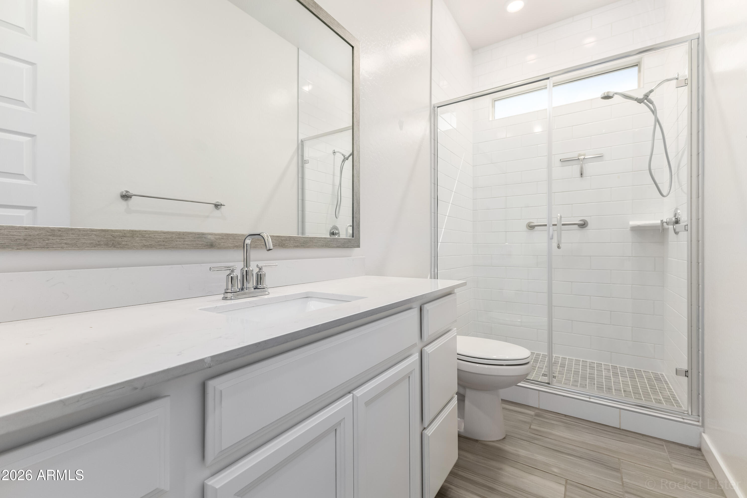 23929 North 166th Lane Surprise, AZ 85387 - Photo 19 of 23 a bathroom with a sink a toilet and shower