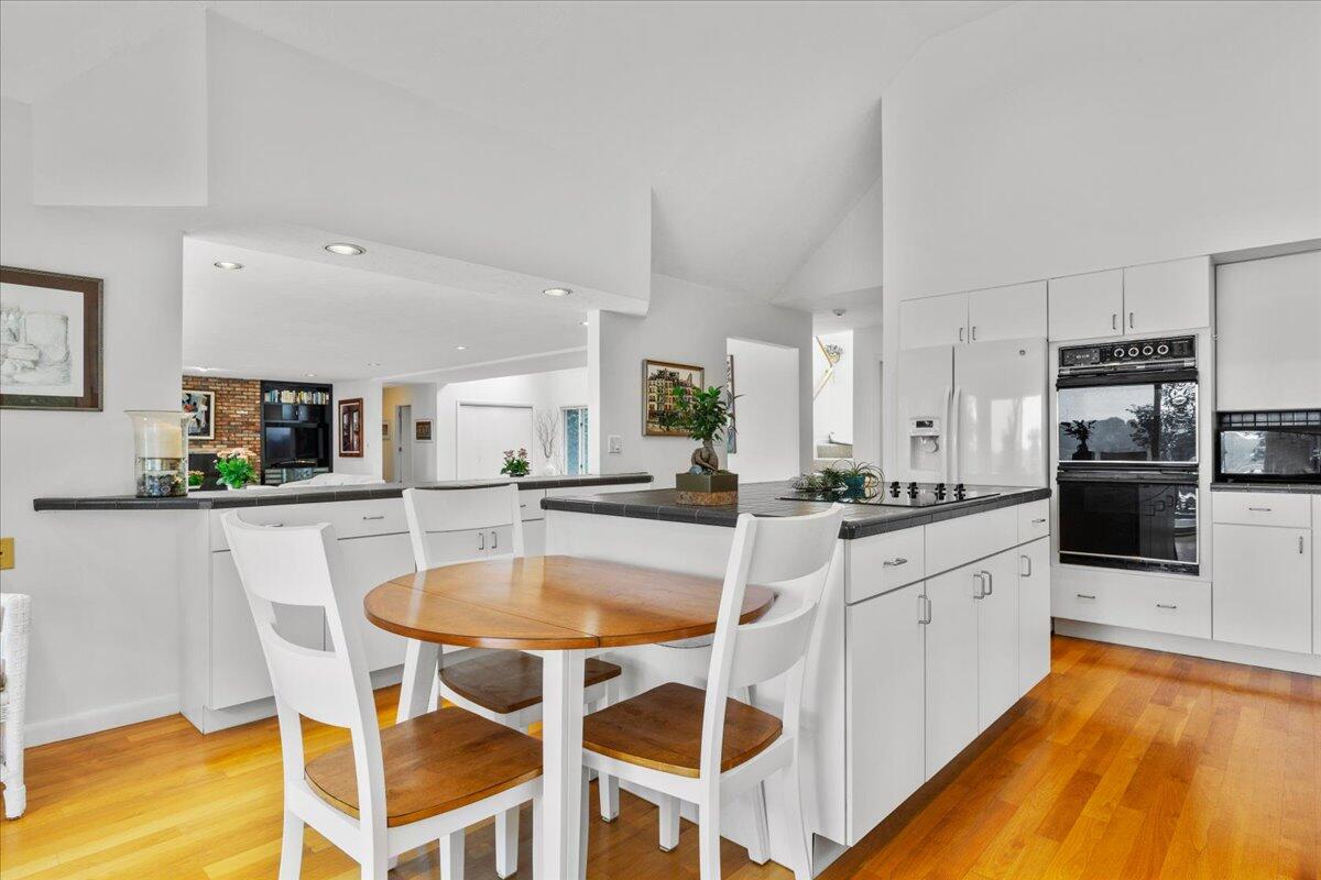 19 Ockway Bay Road Mashpee, MA 02649 - Photo 19 of 79 a large white kitchen with a center island and stainless steel appliances