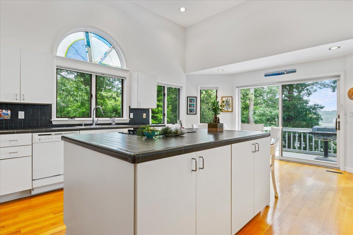19 Ockway Bay Road Mashpee, MA 02649 - Photo 21 of 79 a kitchen with large windows and a sink