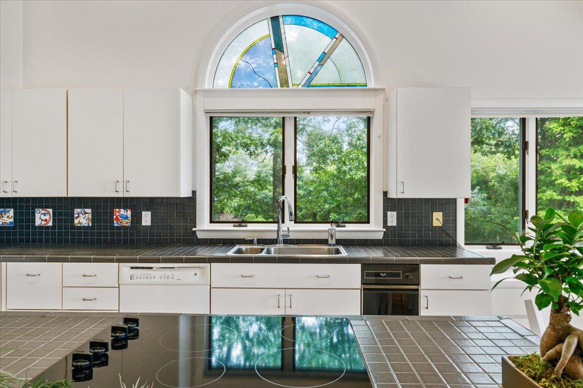 19 Ockway Bay Road Mashpee, MA 02649 - Photo 23 of 79 a kitchen with granite countertop a stove a sink and a microwave