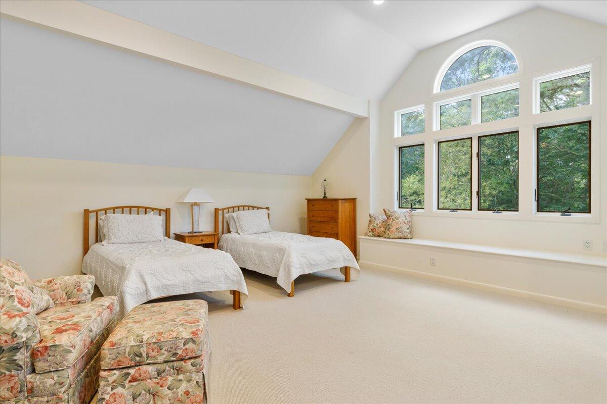19 Ockway Bay Road Mashpee, MA 02649 - Photo 27 of 79 a spacious bedroom with two beds and a large window