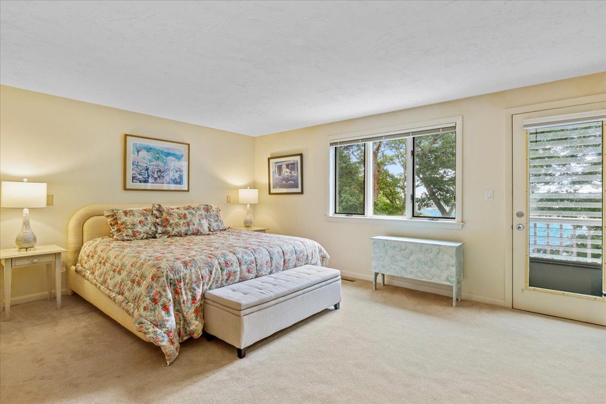 19 Ockway Bay Road Mashpee, MA 02649 - Photo 32 of 79 a spacious bedroom with a bed and a couch