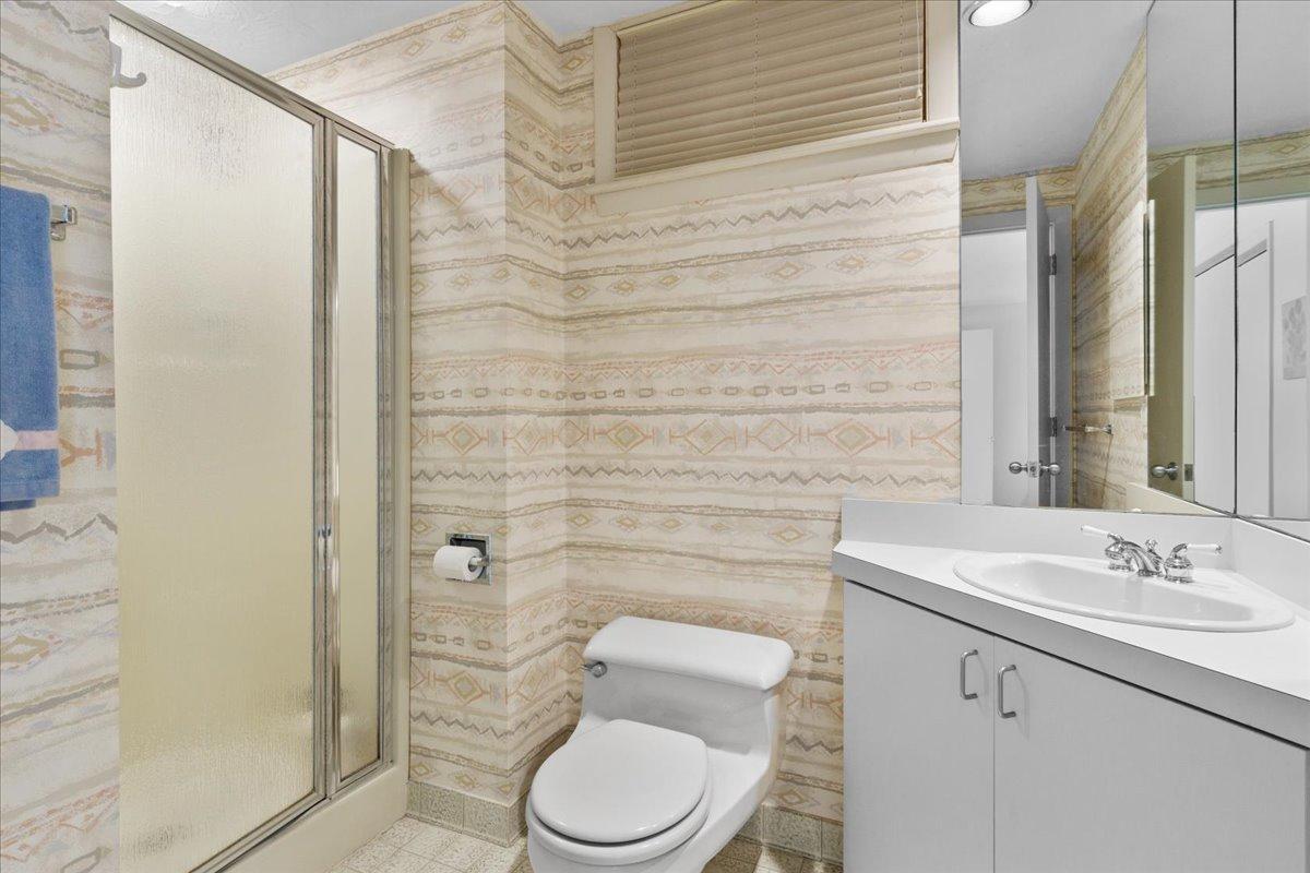 19 Ockway Bay Road Mashpee, MA 02649 - Photo 35 of 79 a bathroom with a toilet sink vanity and shower