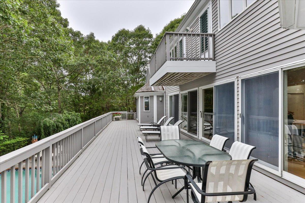 19 Ockway Bay Road Mashpee, MA 02649 - Photo 57 of 79 a view of a patio with a table and chairs