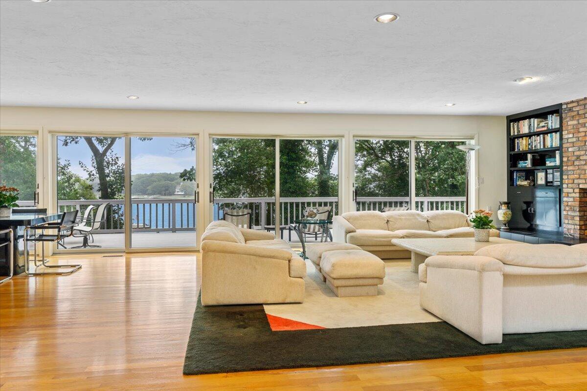 19 Ockway Bay Road Mashpee, MA 02649 - Photo 6 of 79 a living room with fireplace furniture and a large window