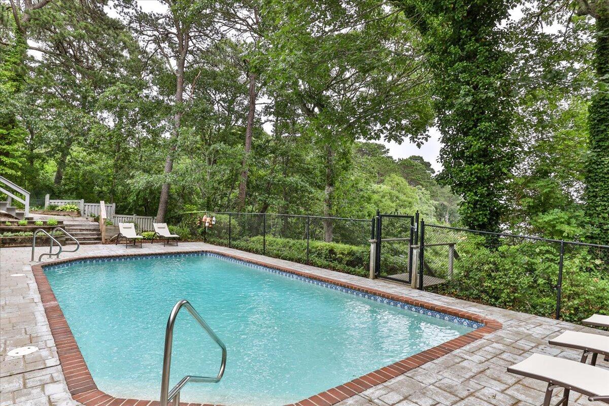 19 Ockway Bay Road Mashpee, MA 02649 - Photo 61 of 79 a view of a swimming pool with a patio
