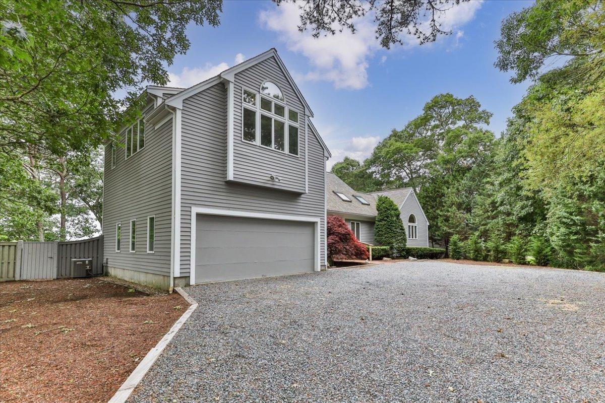 19 Ockway Bay Road Mashpee, MA 02649 - Photo 70 of 79 a view of a house with a yard and garage
