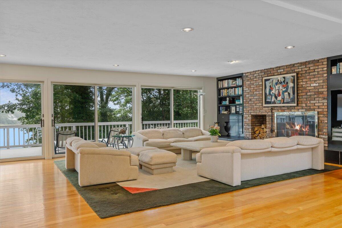 19 Ockway Bay Road Mashpee, MA 02649 - Photo 7 of 79 a living room with fireplace furniture and a large window