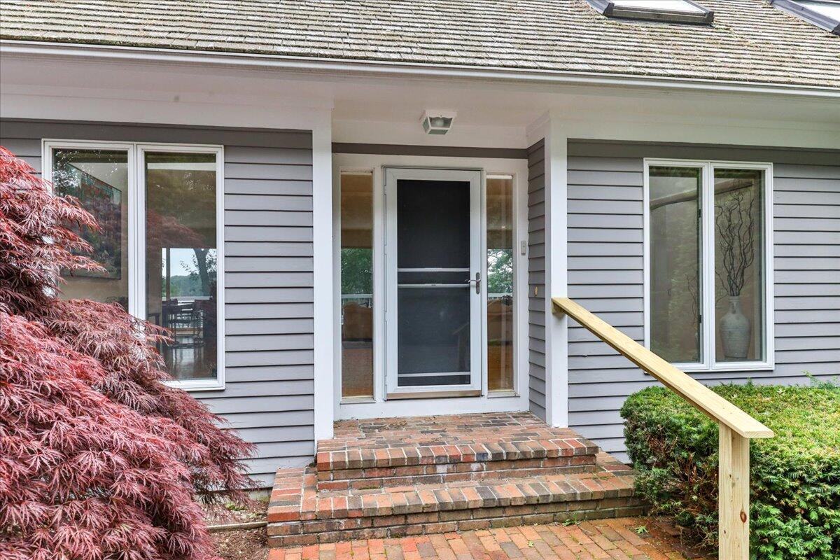 19 Ockway Bay Road Mashpee, MA 02649 - Photo 72 of 79 a front view of a house with a yard and balcony