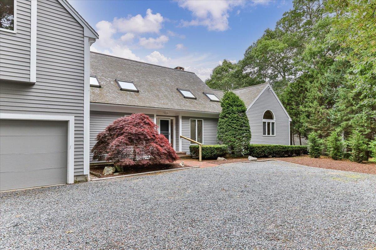 19 Ockway Bay Road Mashpee, MA 02649 - Photo 73 of 79 a view of a house with a yard and garage