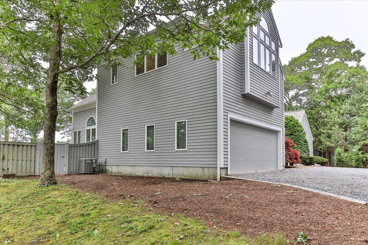 19 Ockway Bay Road Mashpee, MA 02649 - Photo 74 of 79 a view of a house with a yard and large tree