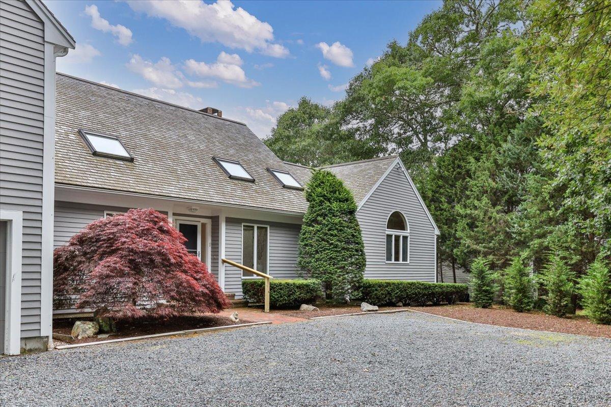 19 Ockway Bay Road Mashpee, MA 02649 - Photo 75 of 79 a front view of a house with a garden