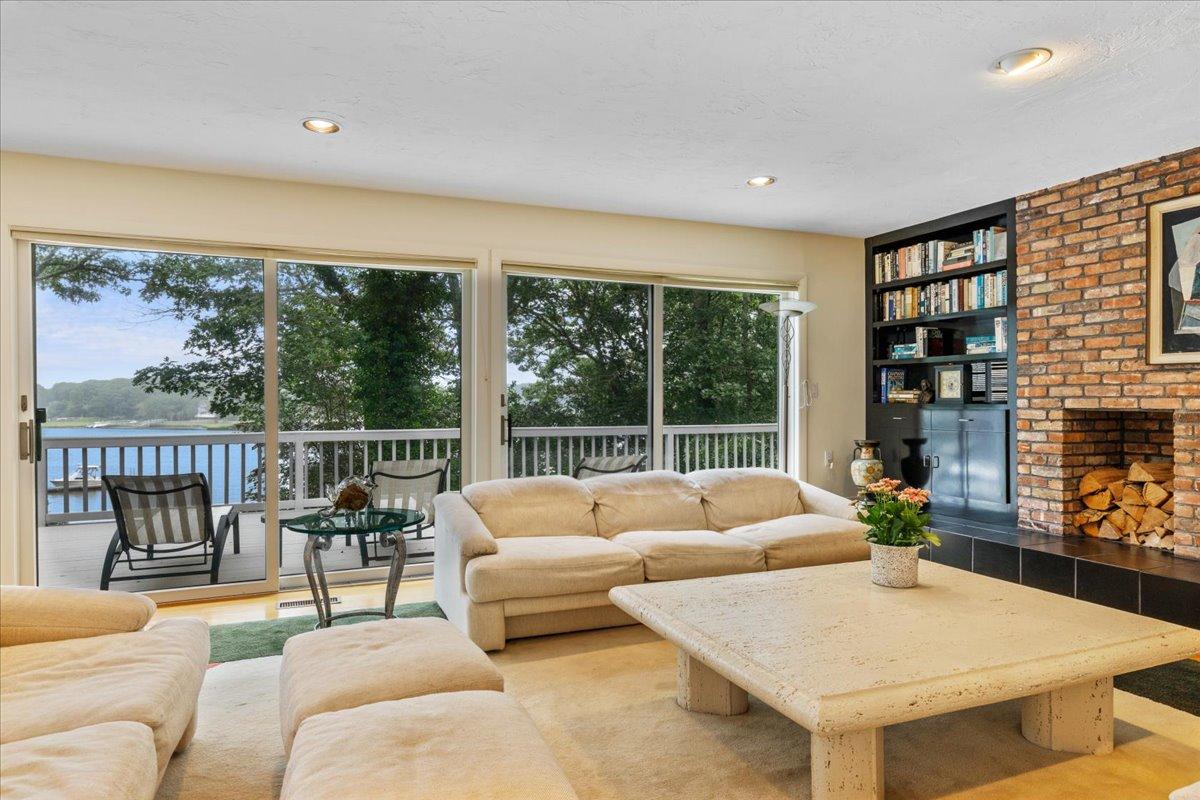 19 Ockway Bay Road Mashpee, MA 02649 - Photo 8 of 79 a living room with furniture and a large window