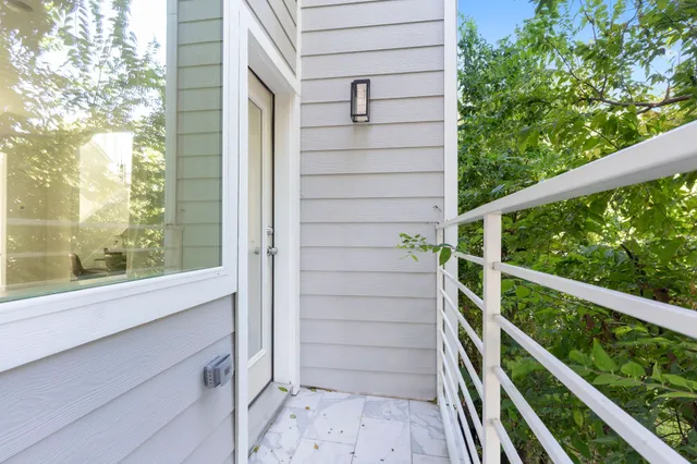 a view of a large building with a porch