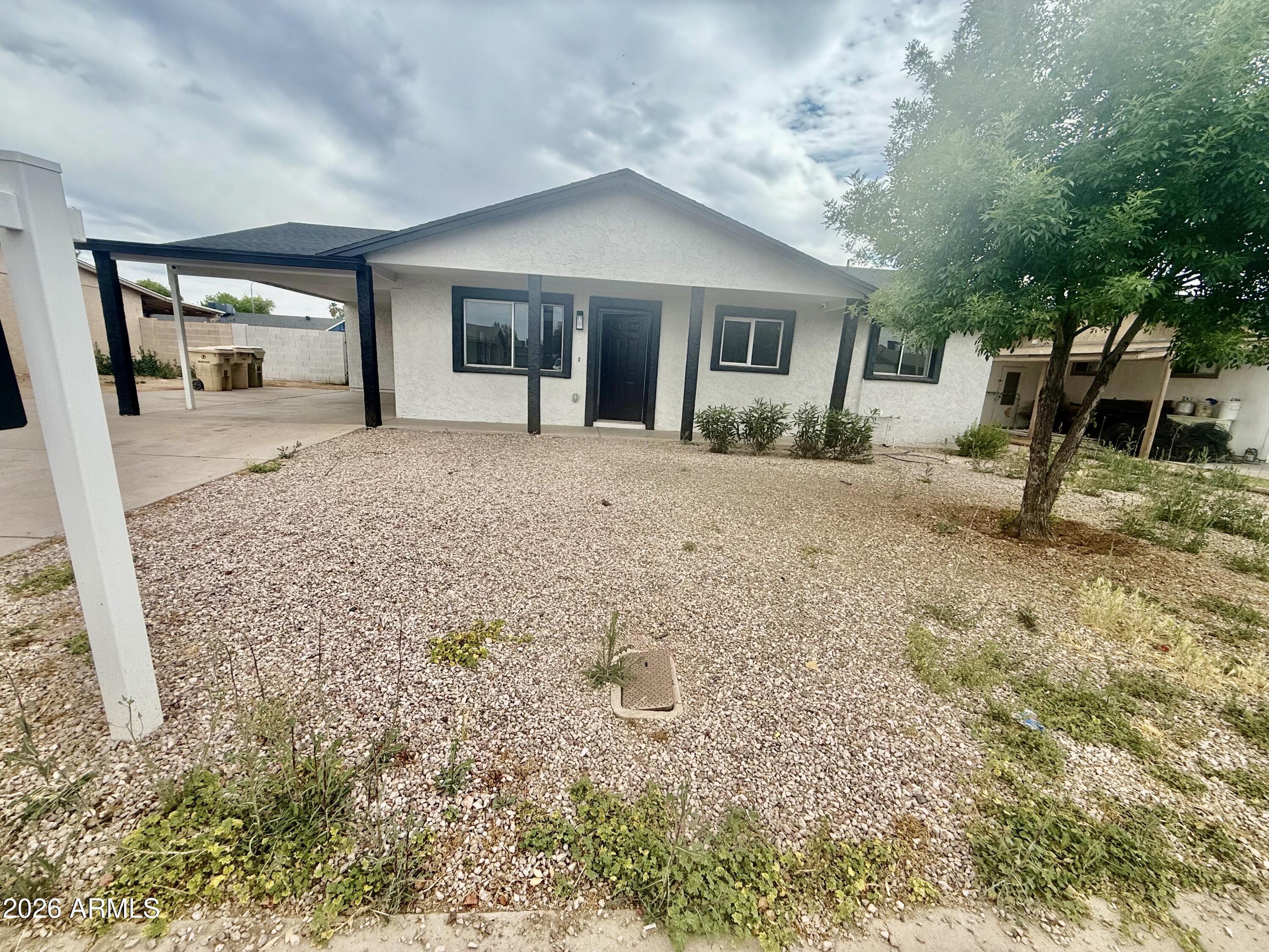 a view of a house with a yard