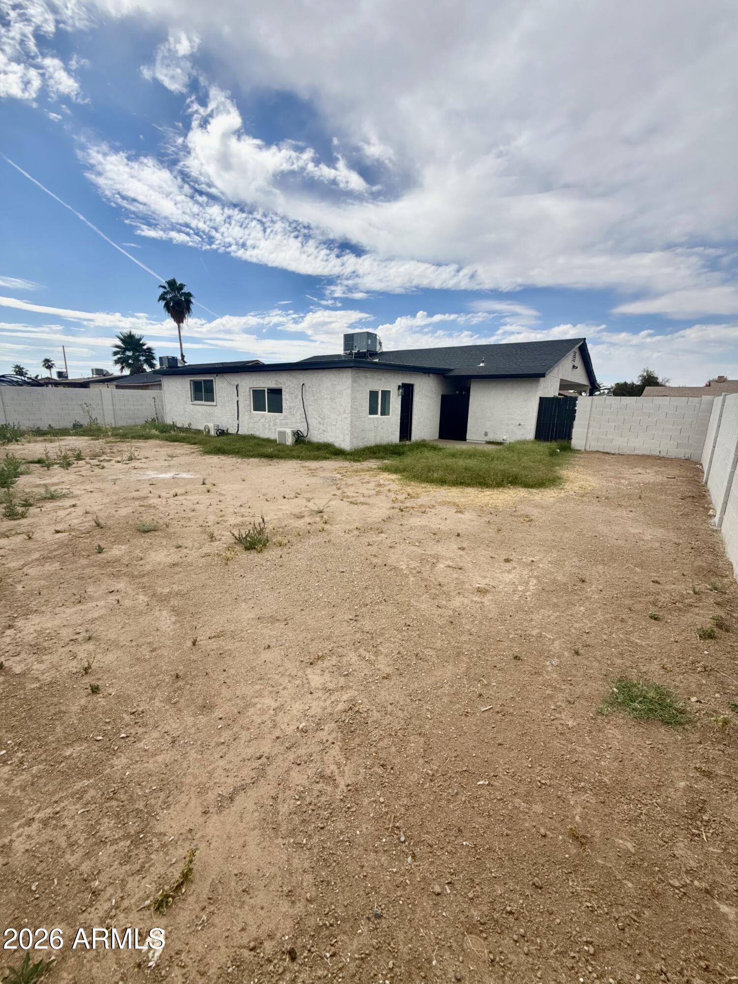 6963 West Rancho Drive Glendale, AZ 85303 - Photo 11 of 14 front view of a house with a yard