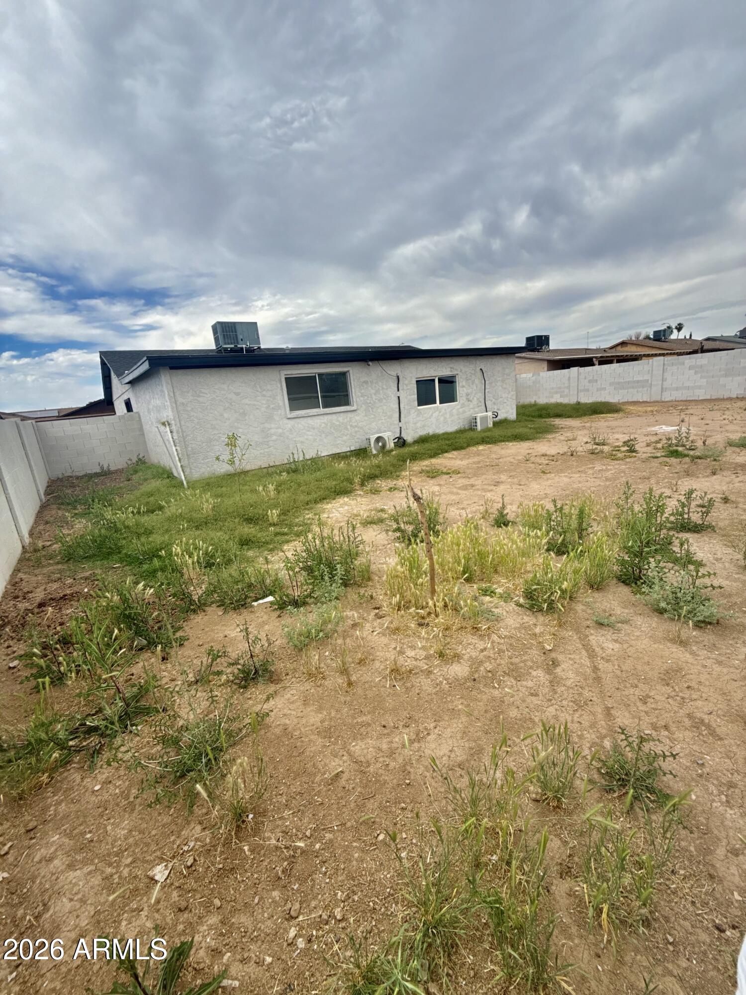 6963 West Rancho Drive Glendale, AZ 85303 - Photo 12 of 14 a backyard of a house