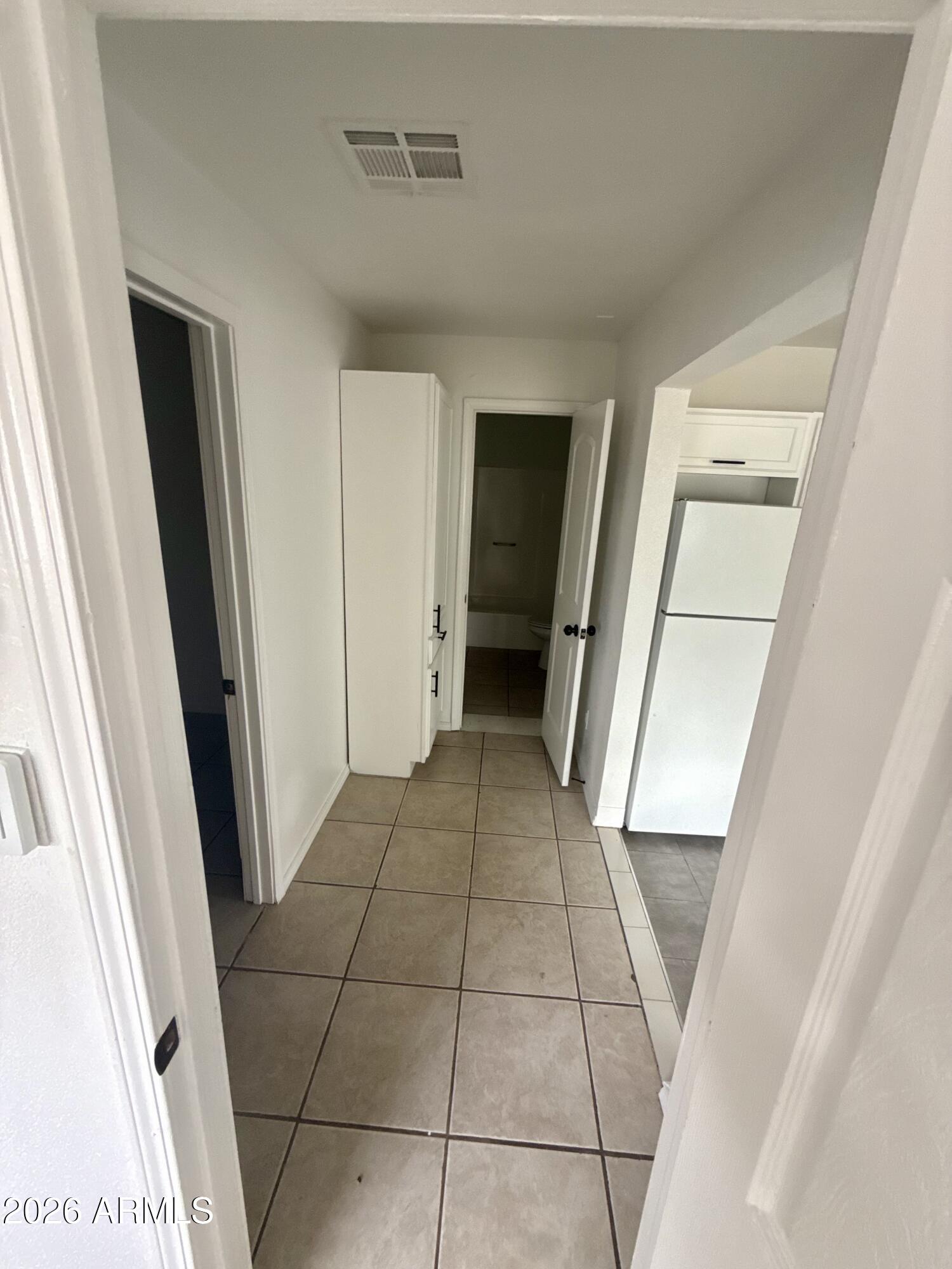 6963 West Rancho Drive Glendale, AZ 85303 - Photo 9 of 14 a view of a hallway view with staircase