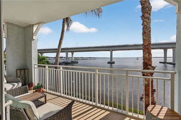 a front view of a house with outdoor seating