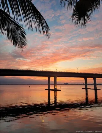 a view of a swimming pool with a lounge chair