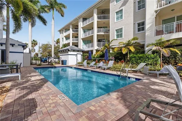 a view of swimming pool with outdoor seating