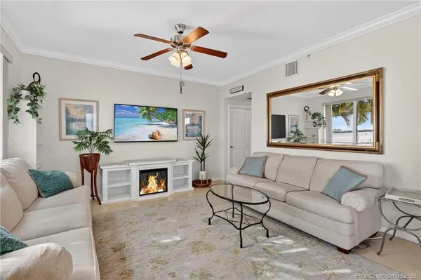 a kitchen with granite countertop white cabinets stainless steel appliances and a sink